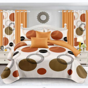 A bedroom with orange curtains and circular patterns on both the bedspread and curtains. The bed has orange and brown pillows, and there are nightstands with lamps on each side. A round mirror hangs above the bed.