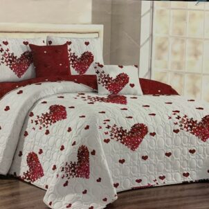 A 5-piece quilt set featuring a heart pattern design set against a white and red background, creating a warm and romantic aesthetic. The bold color contrast and playful motif add charm and personality to the bedding. The set includes a quilt, matching pillow shams, and decorative cushions, perfect for creating a cozy and inviting bedroom atmosphere.