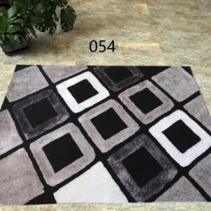 2m x 1.5m non-slip 3D carpet featuring a black background with a block pattern in beige, dark brown, and white. The durable, slip-resistant surface adds a contemporary and stylish touch to any room while ensuring safety and comfort.