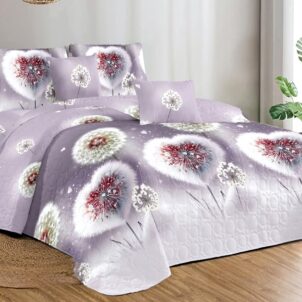 Quilt in soft pink and lilac shades featuring playful, whimsical patterns for a fun and girly look.