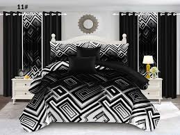 A 7-piece quilt set featuring a bold geometric pattern in striking black and white, creating a strong modern statement. The set includes a quilt, matching pillow shams, decorative cushions and coordinating curtains, offering a complete and cohesive look that brings contemporary style and contrast to any bedroom.