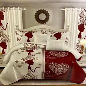 A white and red quilt with a dramatic design featuring the outline of a woman wearing a butterfly-patterned dress, blending abstract and figurative elements.