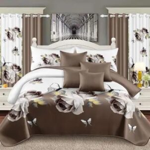 A 7-piece quilt set featuring a classic brown and white floral pattern that brings a warm and inviting touch to the bedroom. The set includes a quilt, matching pillow shams, decorative cushions and coordinating curtains, offering a complete and harmonious look with timeless botanical elegance.