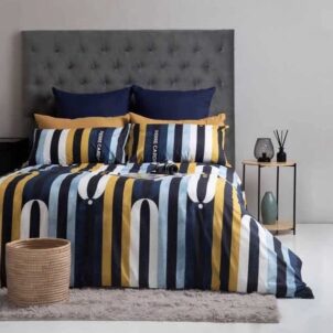 Pierre Cardin duvet cover including 2 pillow cases, crafted with premium fabric for a luxurious feel, featuring an white, blue and yellow design on a dark background that adds sophistication and style to any bedroom decor.