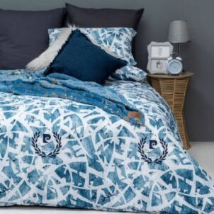 Pierre Cardin duvet cover fit for a single bed and including pillow cases, crafted with premium fabric for a luxurious feel, featuring blue pattern on a white background that adds sophistication and style to any bedroom decor.