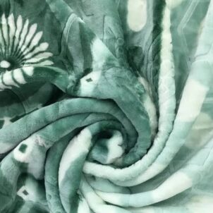 A double size mink blanket in a soft and cozy green color, featuring a plush, velvety texture that offers warmth and comfort. The soothing green tone adds a calming, natural touch to any bedroom or lounging area, making it perfect for everyday use during cooler seasons.
