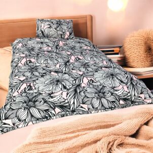 Single to three-quarter comforter set in a barrel bag, includes one standard pillowcase; made from soft 150gsm microfiber in a black floral pattern with a touch of soft pink for added elegance.