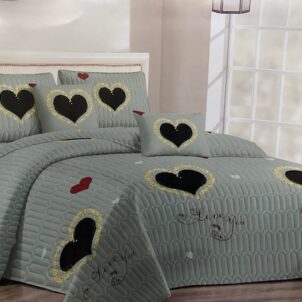 Quilt bedding set featuring black hearts with a touch of yellow on a grey background, creating a fun and vibrant vibe.
