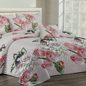 Soft grey quilt adorned with a bouquet pattern of pink and white flowers, adding a gentle and romantic touch to the room.