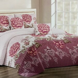 White quilt with a dusty pink border, patterned with bold pink flowers, creating a fresh and feminine design with a touch of elegance.