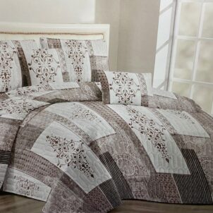 Classic quilt in soft ivory and stone tones, accented with shades of brown for a timeless and elegant appearance.