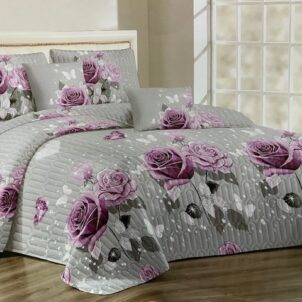 Quilt bedding in a soft grey tone, beautifully accented with bold pink rose patterns, creating a gentle and elegant bedroom look.
