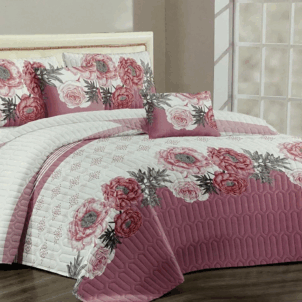 Quilt bedding set featuring a feast of light and dark shades of pink tones, decorated with elegant roses and leaves, adding a stylish and romantic touch to the bedroom.