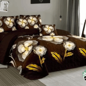 Chocolate brown quilt featuring big, bold white and yellow floral patterns, adding a vibrant and striking contrast to the design.