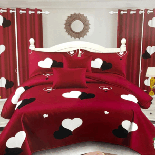 Red quilt featuring a playful pattern of white and black hearts. The bold color palette adds a lively, romantic touch to the design.