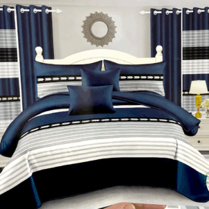 Quilt bedding perfect for a teen boy’s room, featuring bold stripes in navy, light grey, and white. The clean, modern design offers a cool and stylish look with a timeless color palette.