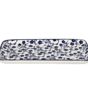 Individual white ceramic plates and bowls with a delicate blue floral pattern and a thin blue border.