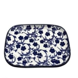 Individual white ceramic plates and bowls with a delicate blue floral pattern and a thin blue border.
