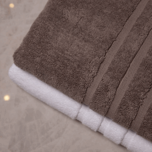 Premium 750gsm bath sheet woven from cotton yarn, offering a rich, plush texture and indulgent weight. Inspired by the opulence of Caesar's Court, it provides an unforgettable luxury experience. Available in white and mud grey, with dyes ensuring optimal colour fastness.