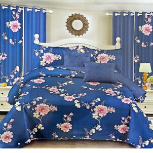 Sea blue quilt with bold pink flowers for a bright, cheerful look.