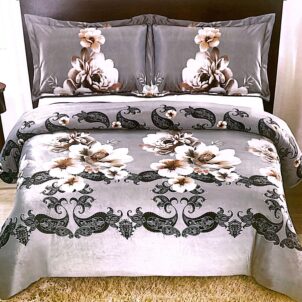 Silver grey quilt featuring a classic black swirl pattern and a bouquet of white flowers, combining elegance with timeless design.