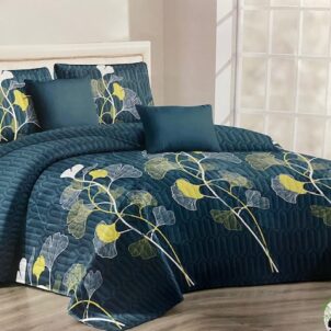 Green quilt featuring a repeating yellow flower pattern.