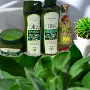 Caimengsi Olive Essence Hair Condition in a green bottle with olive imagery