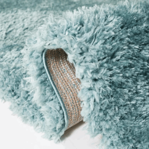 Sea blue bath mat made from soft microfiber, featuring a plush texture and high absorbency for a cozy, quick-drying feel underfoot.