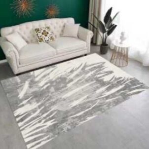 A three-dimensional carpet featuring bold patterns and vibrant, eye-catching colors that create a striking, textured visual effect.