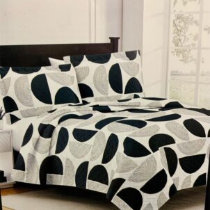 White bedspread featuring a bold, modern black circle pattern.
