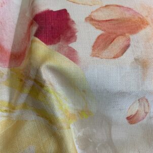 Tablecloth featuring a bouquet design in shades of pink and apricot with splashes of yellow flowers.