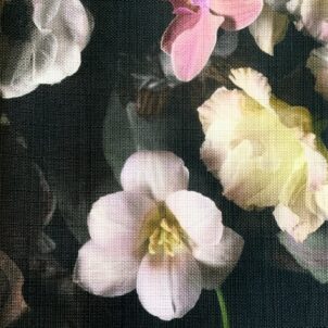 Bouquet of colorful flowers arranged on a black tablecloth.