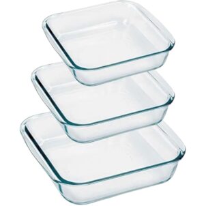A set of three clear glass baking dishes of different sizes, stacked or arranged side by side.