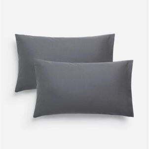 .Set of two smooth pillowcases made from soft, durable fabric, designed for comfort and easy care.