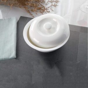 A handy, practical white ceramic casserole dish with a fitted lid, suitable for serving and storing food.