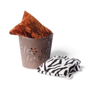 Plastic laundry basket featuring cut-out flower details on the sides for ventilation and decorative style.